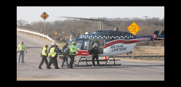Air Evac Services at Spur 490 assisting rollover victims Tuesday Morning.