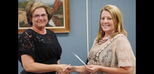 Siebert Elementary PTO President, Peggy Cate presents Principal, Mary Jones with a check for $6,000 to be used towards Phase I of the Playground Project.