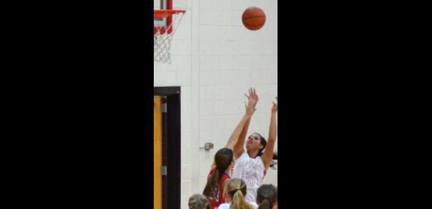 Leighann Elder (20) gets up over the Hico defenders for a post shot.