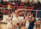 Megan Gray (10) goes up for a lay up against Huckabay with Lauren Spivey (4) and N. Herrera(14) in rebounding position. 