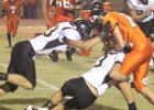 Kotie Hoover (3, bottom) and Carson Teaff (33, top) make a solid tackle of the Indian receiver.