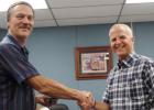 EISD Employee of the Month, Barry Hart (left) is presented a plaque by Principal, Doug Galyean (right) at the July EISD Board of Trustee meeting.