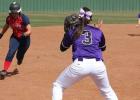 Ruby Aguirre waits for the ball to apply the tag at third.