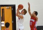 Josh Gosnell (1) goes up for a lay up vs. Graham