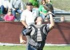 Catcher, Justin Howard, attempting to catch the foul ball.